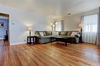 Original hardwood floors greet you as the living r