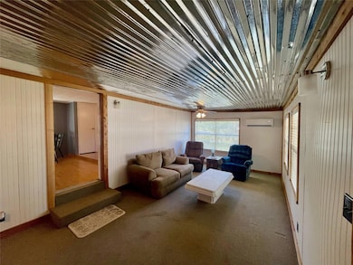 View upon entering the cabin; paneled walls have b