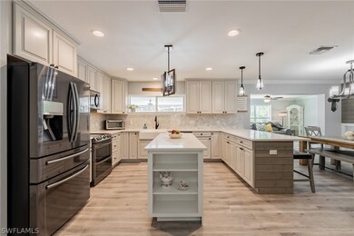 Open island kitchen with raised panel glazed cabin