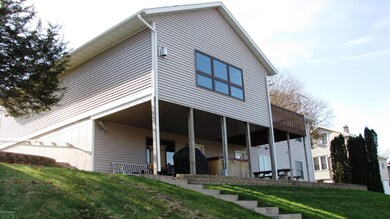 Rear View Of Home & Backyard