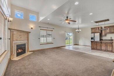 Unfurnished living room featuring recessed lighting, light carpet, a high end fireplace, a ceiling fan, and light tile patterned floors