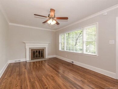 Living Room features fresh paint, crown moulding t