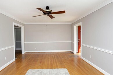 The living room opens into the formal di