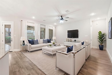 This is a bright and spacious staged living room w