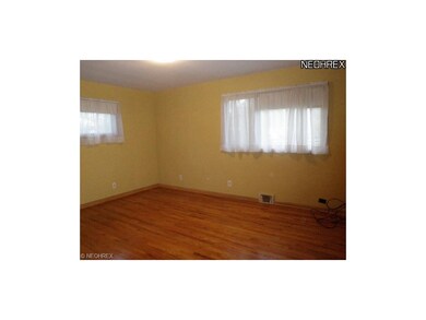 Master bedroom newly painted with pretty hardwood 