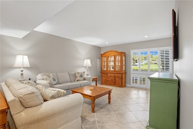 lots of light, back deck on other side of windows facing golf course