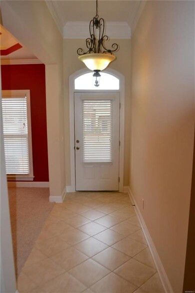 Welcome in - foyer has tiled floor, tall ceilings,