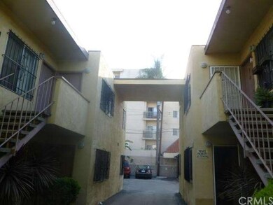 Two buildings are 'slightly' attached.  Looking from front towards back parking area.