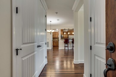 View from the front door. Laundry on the left and guest suite on the right