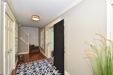 Welcoming foyer with huge guest closet for coats &