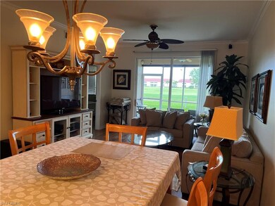 Dining room with ornamental molding, ceiling fan w