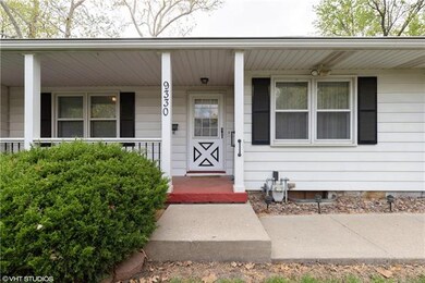 Inviting front porch welcomes you to this lovely h