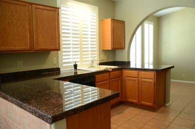 Kitchen w/ granite tiles