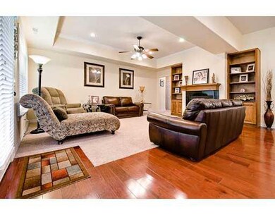 Den/Family/Great Room. One of two living spaces, this one open to kitchen area with cozy fireplace.