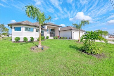 View of front of home with a garage, a front yard,