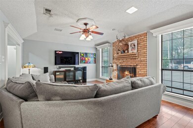 Living room featuring dark wood-type flooring, cei