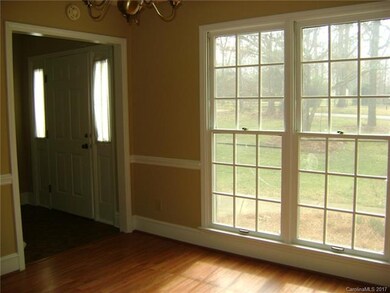 Dining room with double windows off foyer
