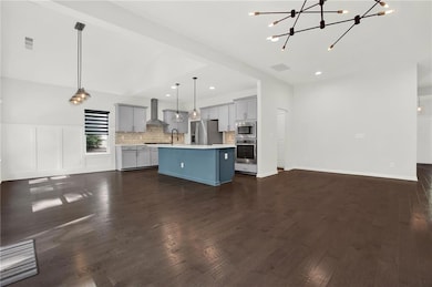 Kitchen featuring light countertops, visible vents
