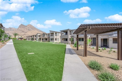 View of community featuring a residential view, a lawn, and a mountain view