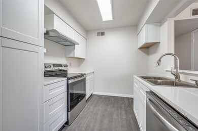 Kitchen with sink, stainless steel appliances, ext