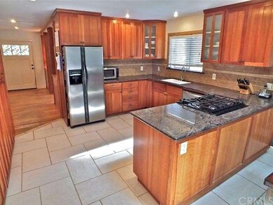 remodeled kithcen with new cabinets and granite co