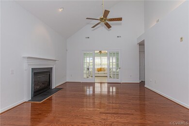 Unfurnished living room with hardwood / wood-style