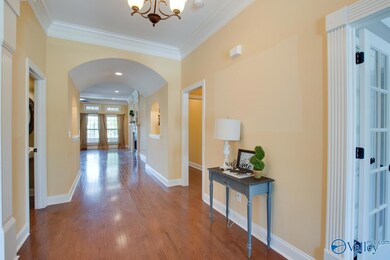 Enjoy the fabulous details of crown moulding, arched doorways, and heavy trim throughout - after entering the home, the office is immediately to your right followed by the 2nd bedroom.