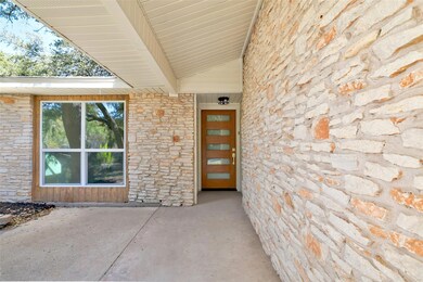 View of exterior entry with stone siding