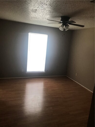 Empty room featuring dark hardwood / wood-style fl