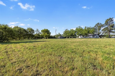 View of yard with a rural view