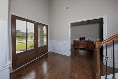 Beautiful hardwoods greet you at the entrance.