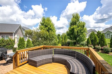 Rear deck and patio overlooking the private, lands