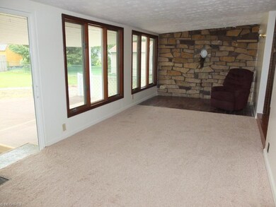 Open family room with lots of natural light and st