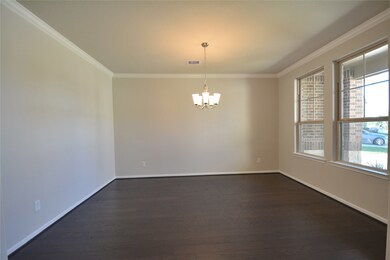 Formal Dining Room with High Ceilings and Wood Floors.  Wonderful area for all those Family and Friends Gathering.