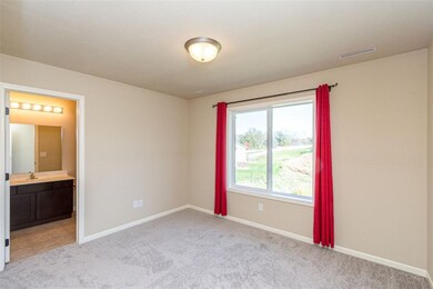 Secondary bedroom, facing the back yard - great vi