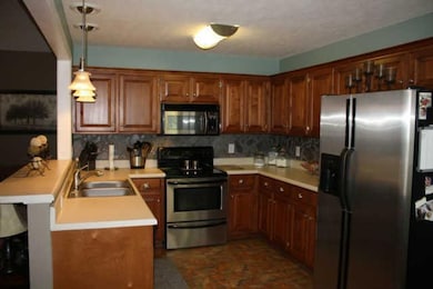 Spacious kitchen with plenty of cabinets and stainless appliances