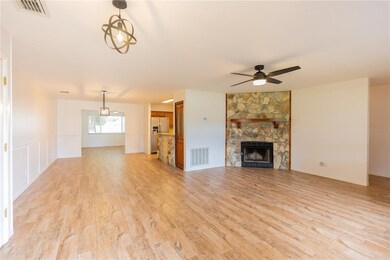 LIVING ROOM WITH WOOD BURNING FIREPLACE