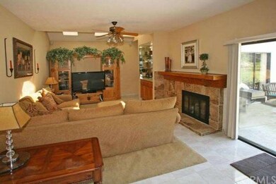 Family room with fireplace leads out to backyard