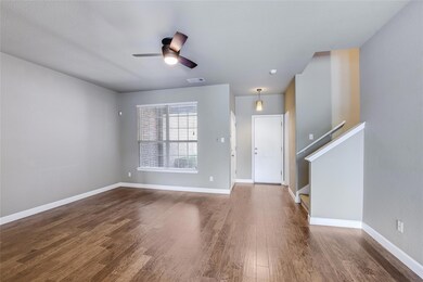 Foyer entrance featuring wood finished floors, ce