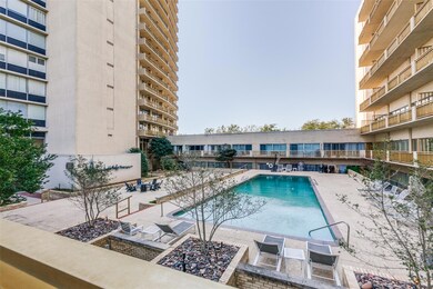 The balcony overlooks the pool & firepit area