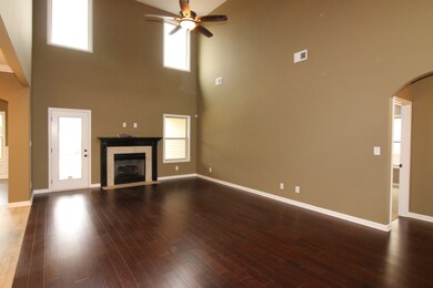 EXAMPLE>>>Large Great Room with HIGH Ceiling, Wood Flooring and a GAS Fireplace! LOTS of Natural Sunlight!