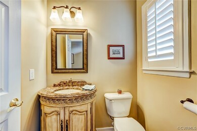 Downstairs half bath is well appointed with custom