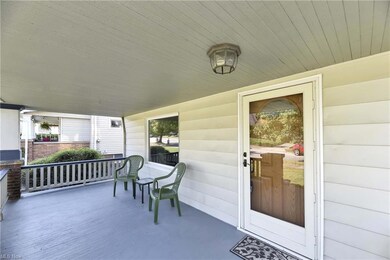 Entrance to property featuring covered porch