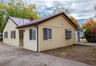 With Driveway leading to side door