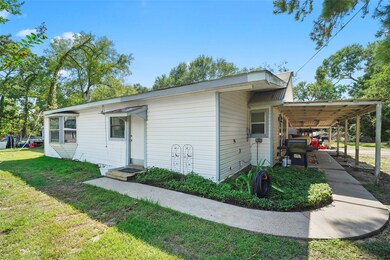 Side view of the main house with covered porch.