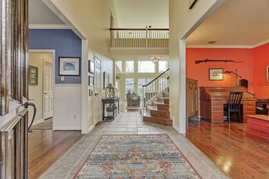 Grand foyer with a tiled entry, two story ceilings and open and desirable floor plan.