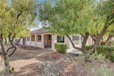 View of front of house featuring stucco siding and