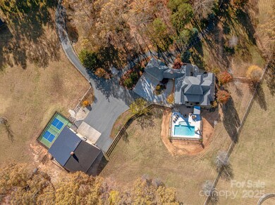 Aerial showing close proximity of shop and house