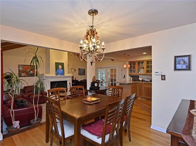 The entry opens to the formal dining room and wide
