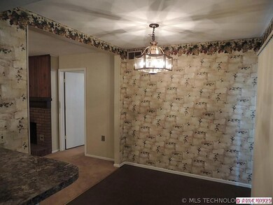 The dining are opens to the kitchen and the family